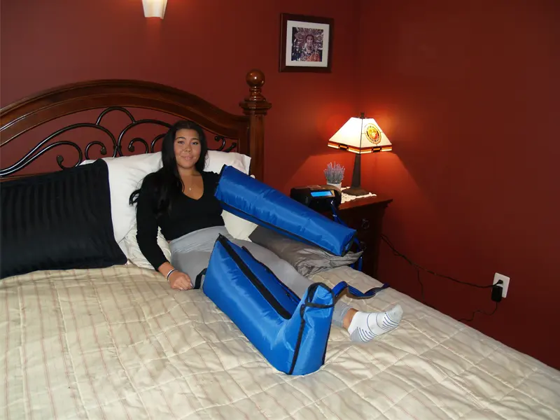 Patient using a custom lymphedema treatment wrap designed for complex edema management.